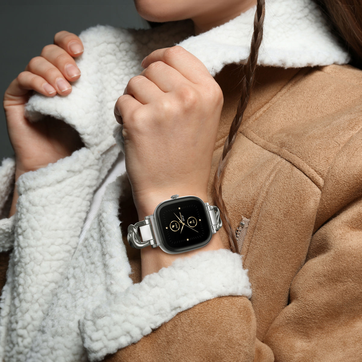 woman wearing fur trim coat and smartwatch